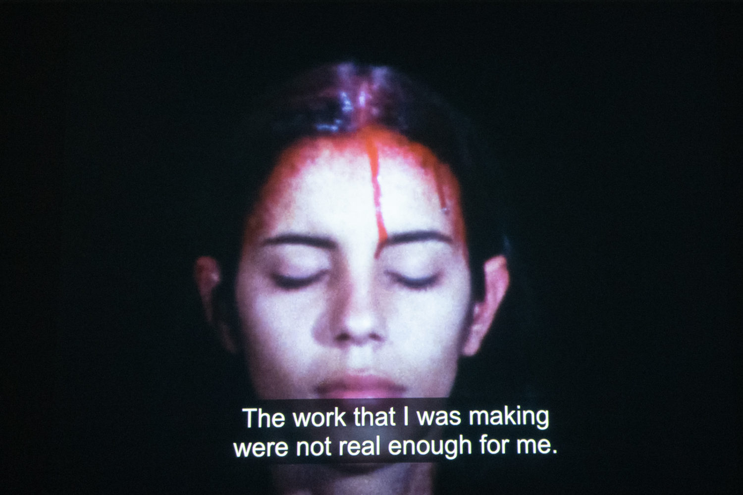 Still from moving image documentation of Ana Mendieta work in "Elemental" at RIT City Space Gallery