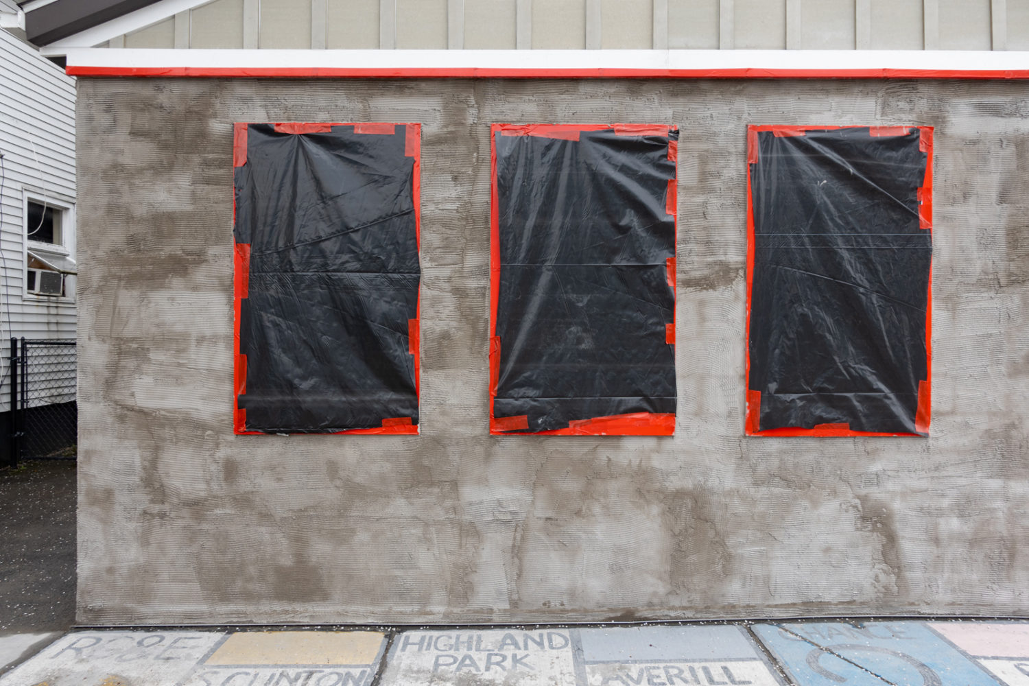 Plastic covered windows on South Clinton