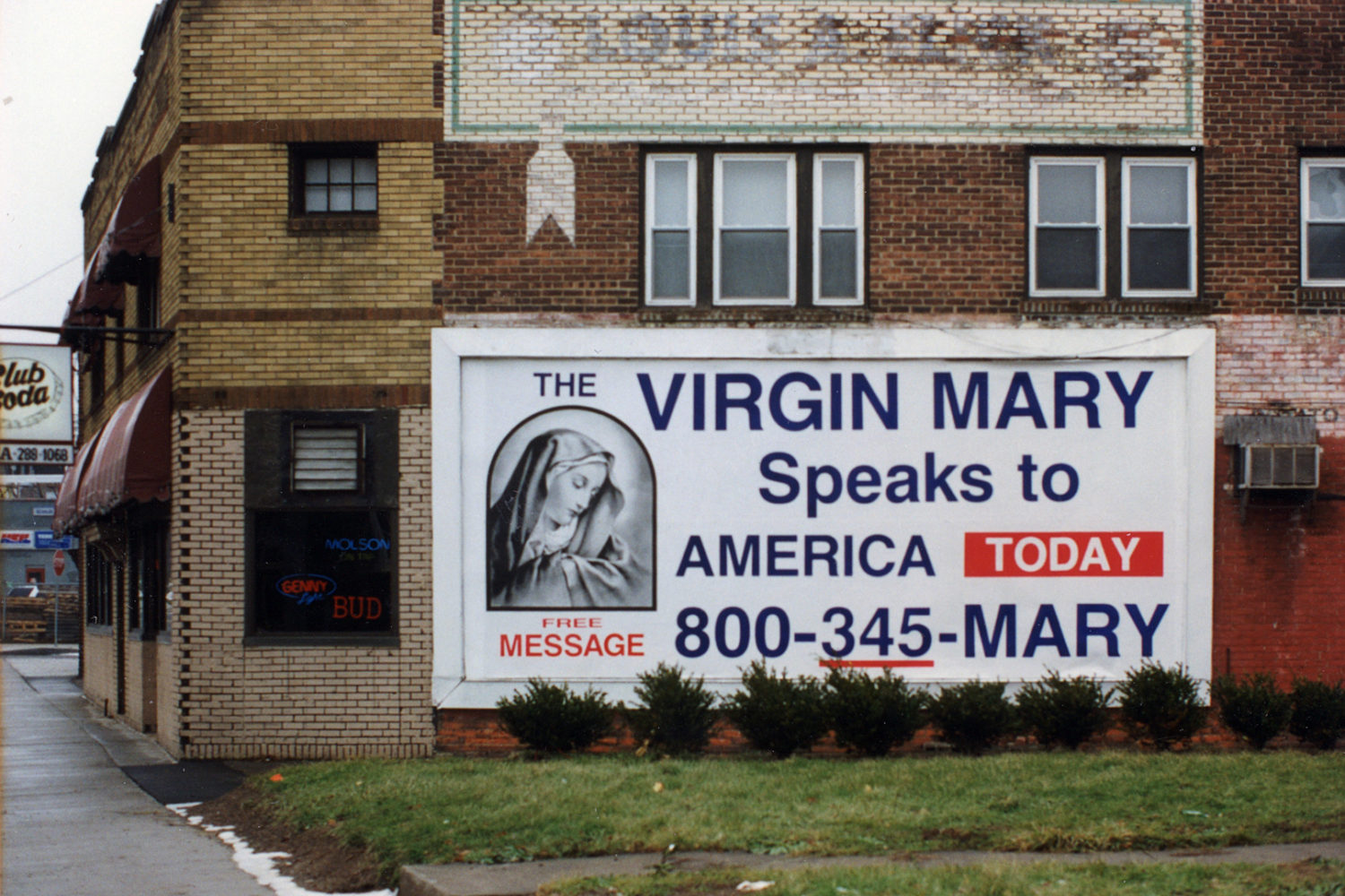 "Virgin Mary Speaks" billboard on Main and Hall Street in Rochester, New York