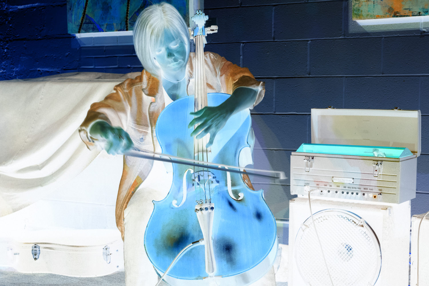 Melissa Davis playing cello at the Little Theatre Café