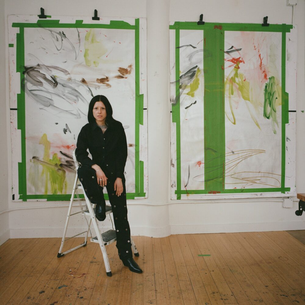 Violet Dennison with her work in her studio. Photo by New York Times.