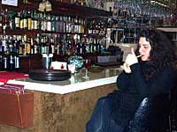 Cheryl Lauro enjoying a cigarette at the bar of Mama Rosa's on Norton Street in Rochester New York
