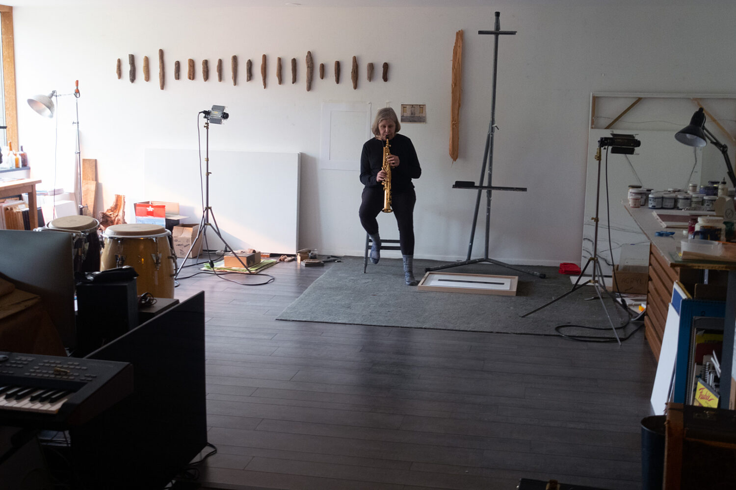 Peggi playing sax in the art room