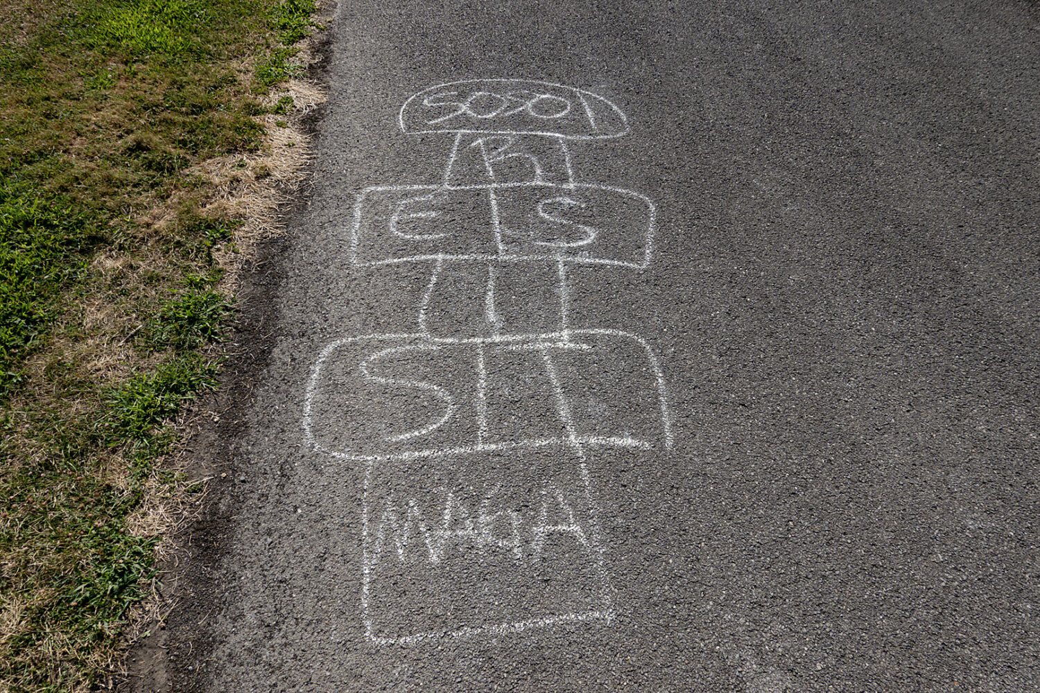Resist graffiti on on sidewalk at Durand Eastman Beach