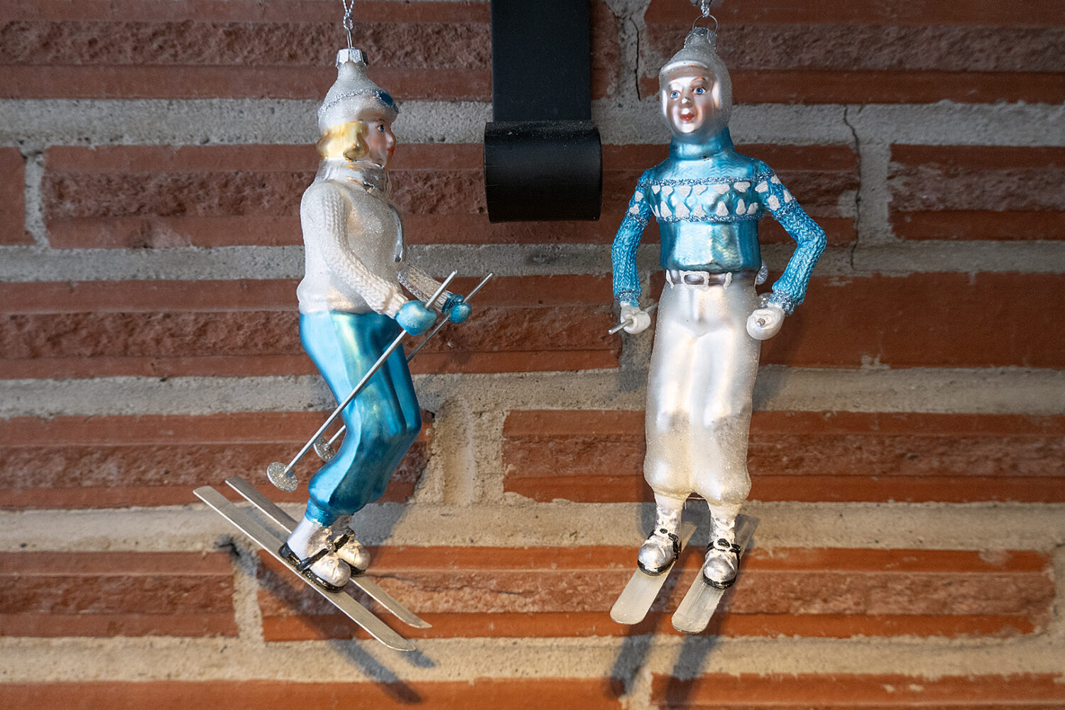 Two small skiers hanging from our fireplace, a gift from Janet Marshall.