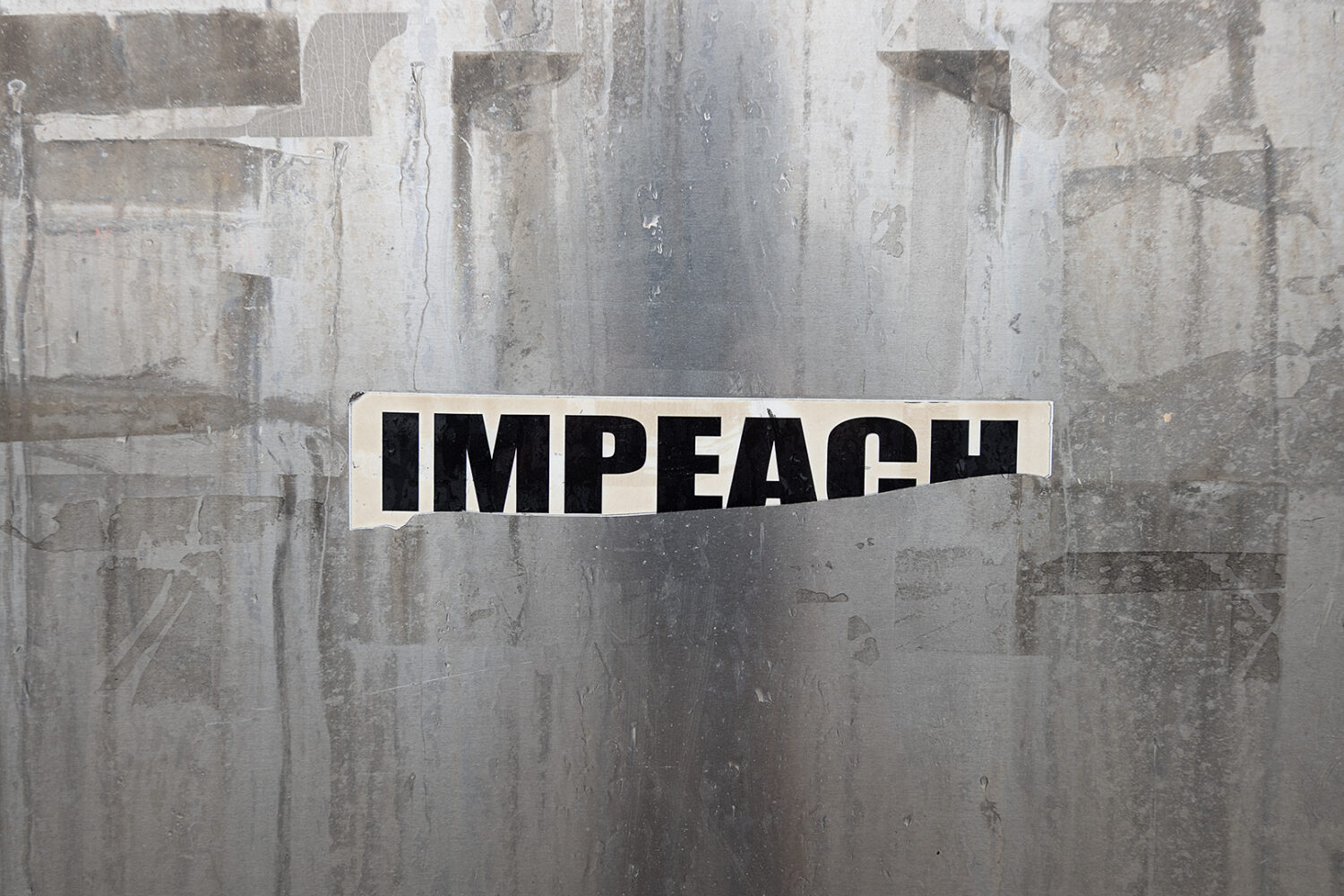 Impeach sticker on  utility box at the corner of Goodman and East Ridge