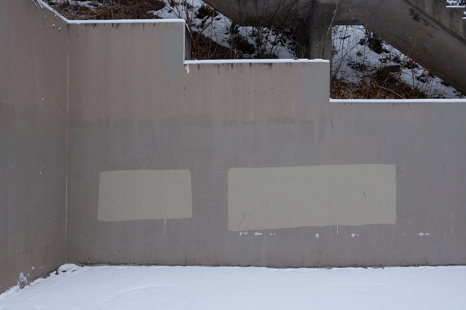 Graffiti cover-up paint on wall leading to Seneca Park bridge