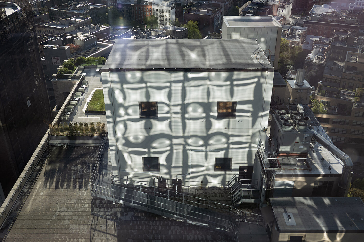 Reflection from hotel windows on building in lower Manhattan