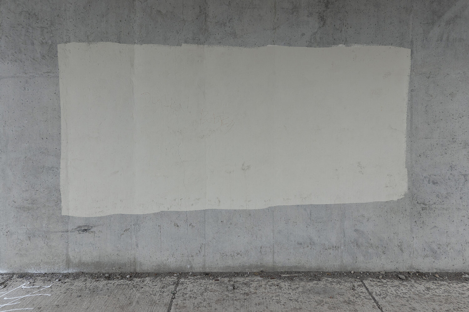Graffiti cover-up paint on wall under Expressway on East Ridge Road