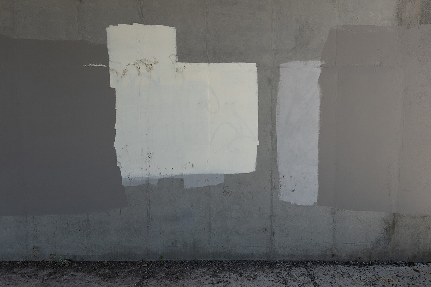 Graffiti cover-up paint on wall under Expressway on East Ridge Road