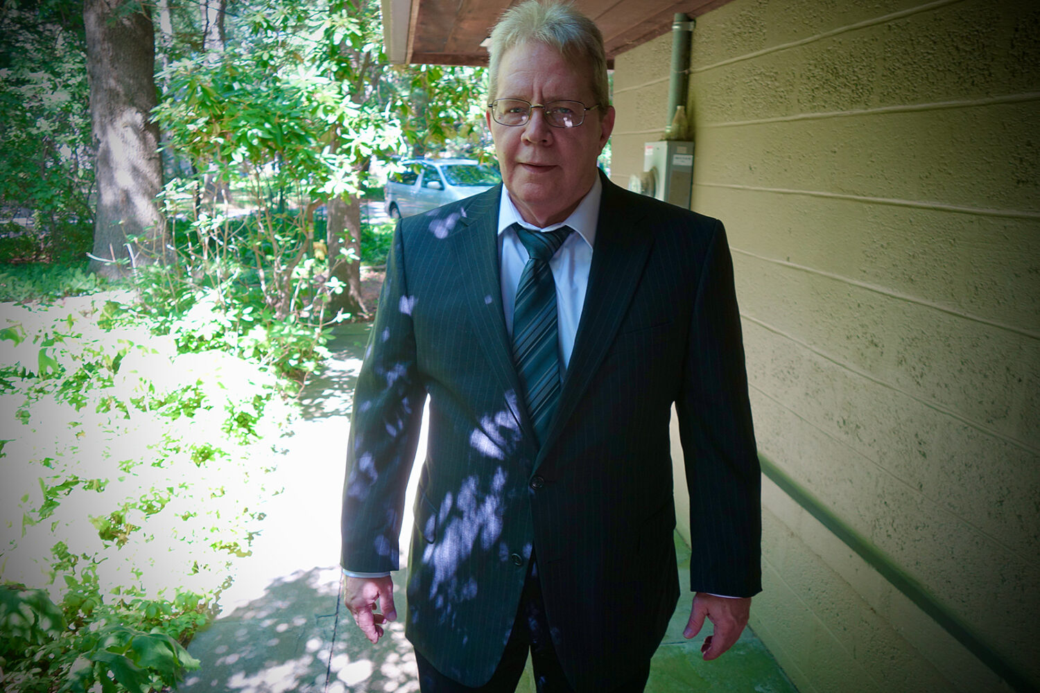 John Gilmore in a suit post Kodak