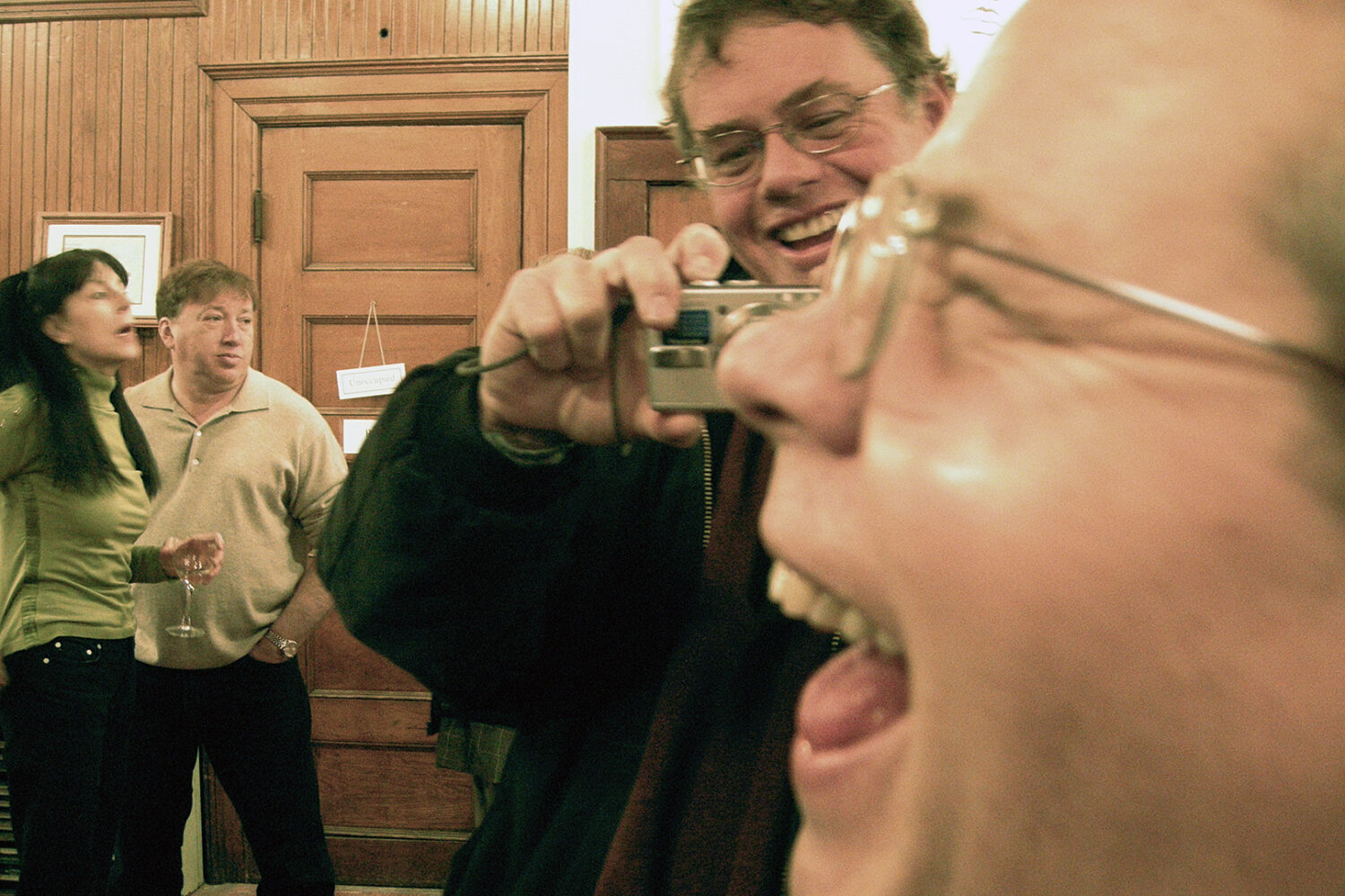 Stan Merrill taking a photo of John Gilmore at Paul Dodd "Crime Faces" opening.