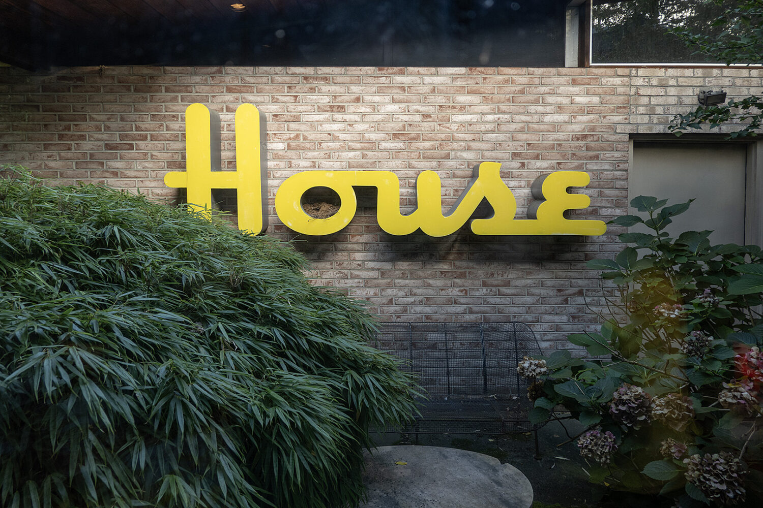 House sign in courtyard of Alcoa house in Rochester