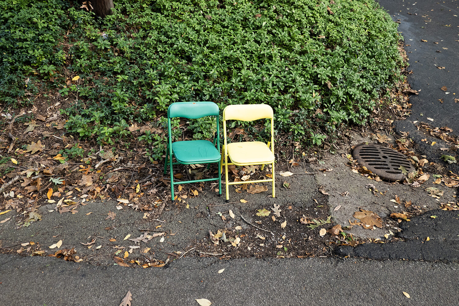 Two tiny chairs by the road